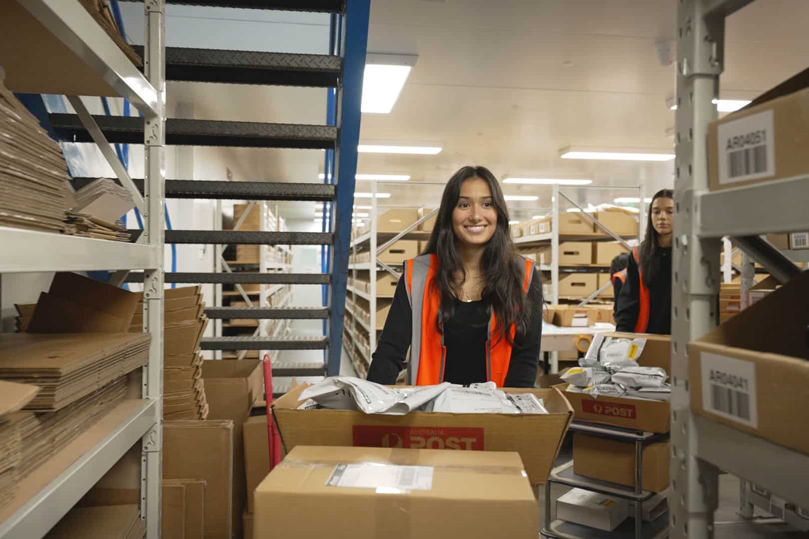 Two Fulfilment Australia employees arranging goods in the warehouse