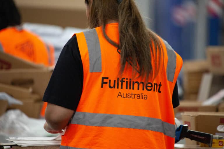 A Fulfilment Australia employee labelling products in the warehouse